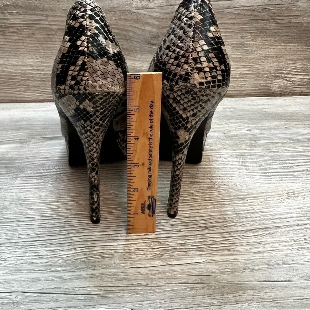 Olsenboye tall platform snakeskin patterned high heels. Closed toe size 9